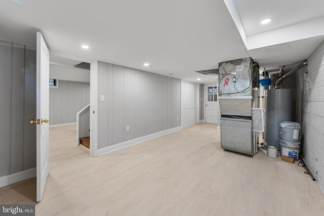 1604 Crittenden St NE, Washington, DC 20017 - finished below grade area with water heater, light wood-style flooring, baseboards, and heating unit