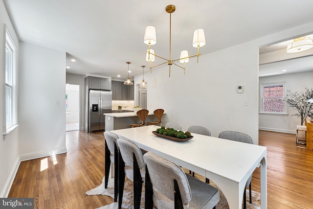 1604 Crittenden St NE, Washington, DC 20017 - dining space featuring wood finished floors, baseboards, recessed lighting, and a chandelier