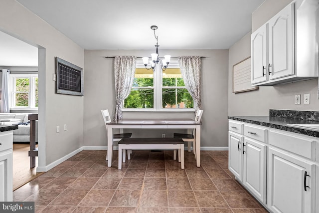 208 N Warwick Rd, Magnolia, NJ 08049 - dining area with a chandelier and baseboards