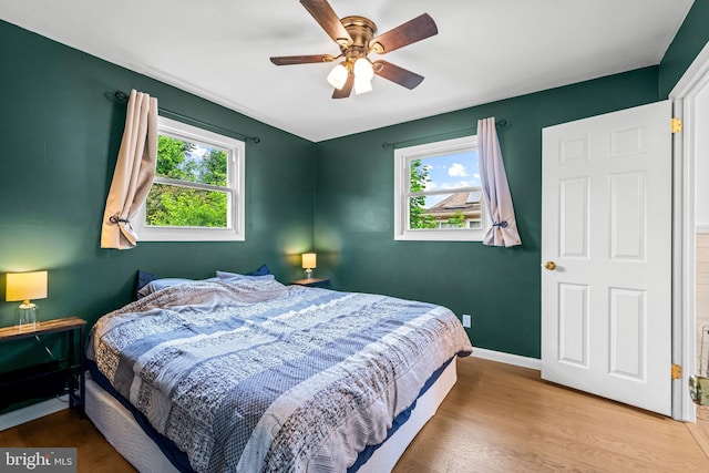 208 N Warwick Rd, Magnolia, NJ 08049 - bedroom featuring wood finished floors, baseboards, and a ceiling fan