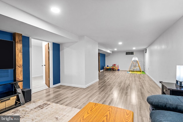 208 N Warwick Rd, Magnolia, NJ 08049 - living area featuring wood finished floors, recessed lighting, and baseboards