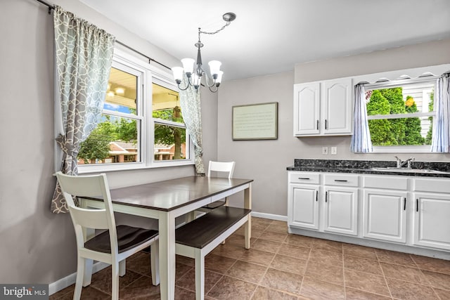 208 N Warwick Rd, Magnolia, NJ 08049 - dining area with a chandelier and baseboards
