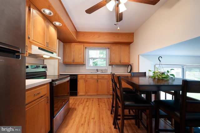 38 Gill Dr, Newark, DE 19713 - kitchen featuring under cabinet range hood, appliances with stainless steel finishes, a sink, light wood-style flooring, and light countertops
