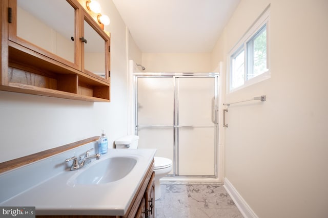 38 Gill Dr, Newark, DE 19713 - bathroom featuring marble finish floors, a shower stall, toilet, vanity, and baseboards