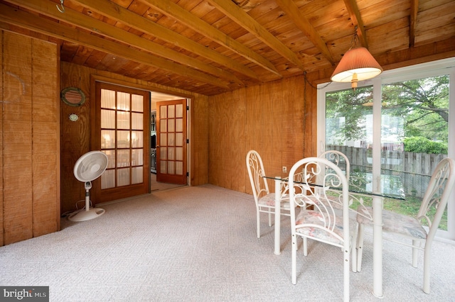 38 Gill Dr, Newark, DE 19713 - unfurnished dining area featuring carpet floors, wood ceiling with exposed beams, and wood walls