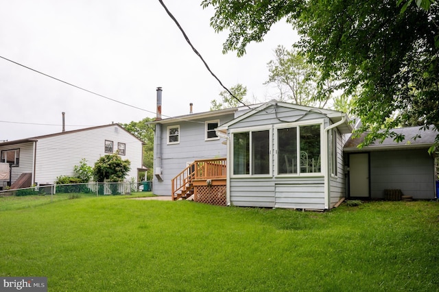 38 Gill Dr, Newark, DE 19713 - back of property with a sunroom, stairway, and a deck