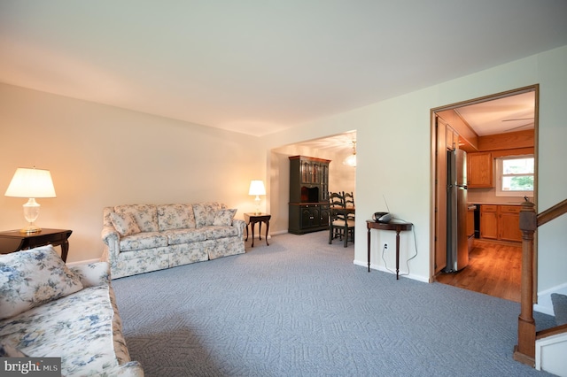 38 Gill Dr, Newark, DE 19713 - living area with stairway, carpet floors, and baseboards