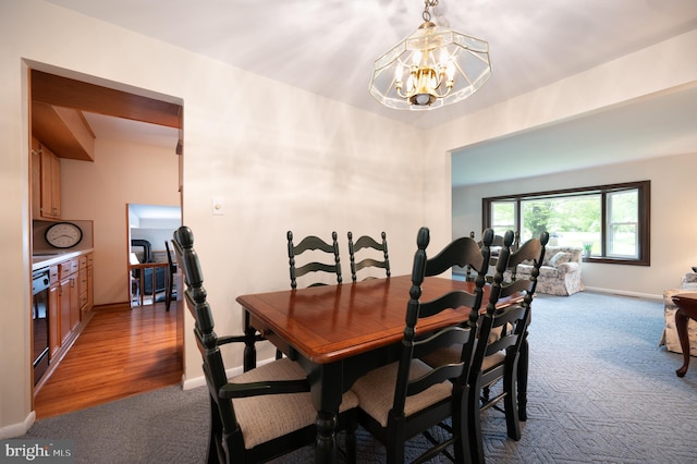 38 Gill Dr, Newark, DE 19713 - dining area with carpet flooring, a chandelier, baseboards, and beverage cooler
