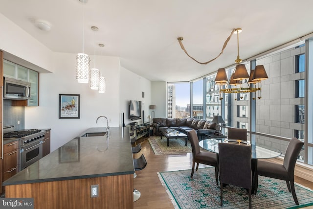 1414 S Penn Sq Unit 28A, Philadelphia, PA 19102 - dining room featuring a chandelier, dark wood-style floors, and floor to ceiling windows