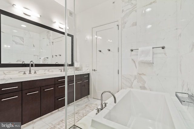 1414 S Penn Sq Unit 28A, Philadelphia, PA 19102 - full bath with double vanity, a bath, and marble finish floors