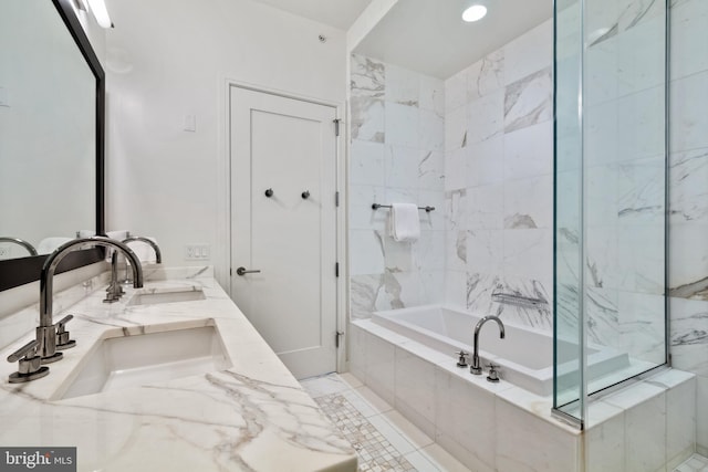 1414 S Penn Sq Unit 28A, Philadelphia, PA 19102 - bathroom with tiled tub, double vanity, a marble finish shower, and recessed lighting