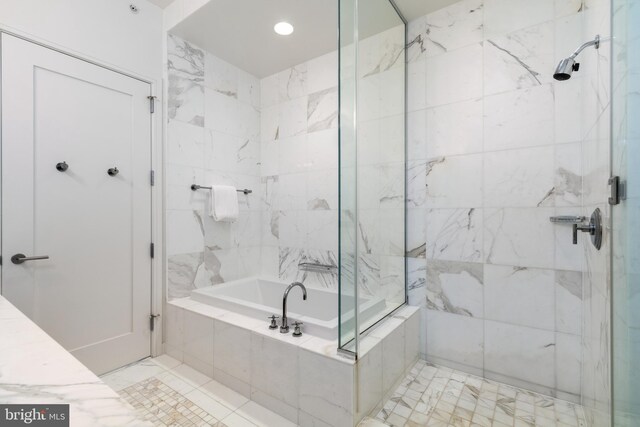 1414 S Penn Sq Unit 28A, Philadelphia, PA 19102 - bathroom with a garden tub and a tile shower