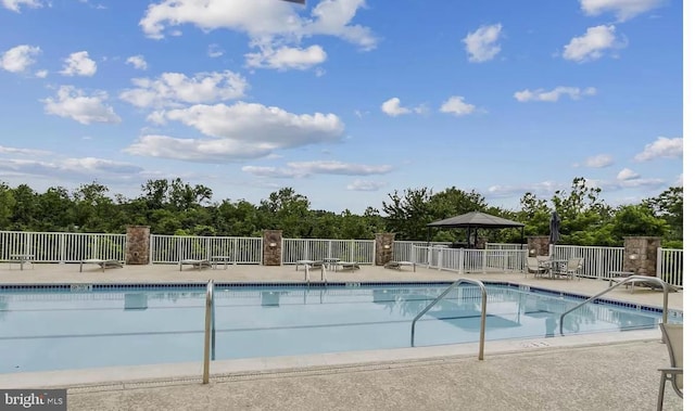 6301 Edsall Rd Unit 224, Alexandria, VA 22312 - community pool featuring a gazebo, view of scattered trees, and a patio area