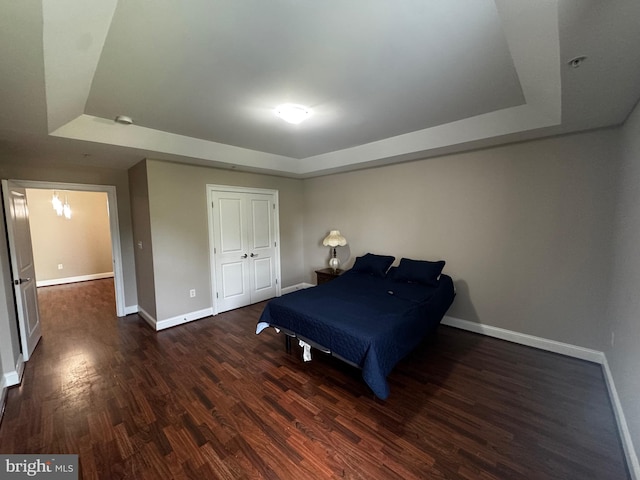 6301 Edsall Rd Unit 224, Alexandria, VA 22312 - bedroom featuring a raised ceiling and wood finished floors
