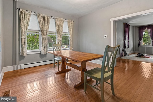 12 E Charles St, Palmyra, NJ 08065 - dining room with a baseboard heating unit and hardwood / wood-style flooring