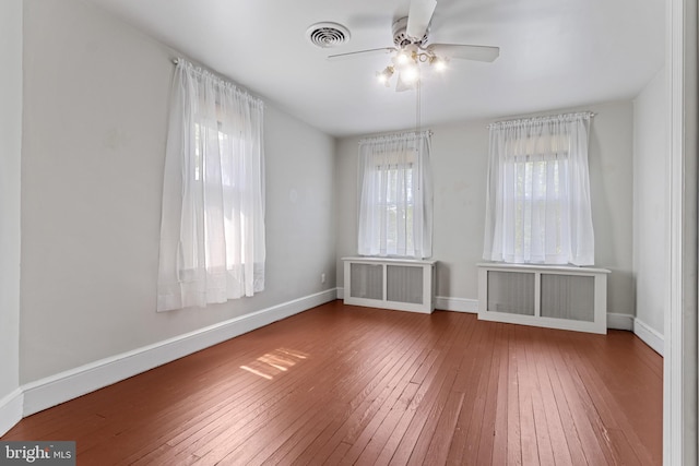 12 E Charles St, Palmyra, NJ 08065 - spare room with radiator, hardwood / wood-style flooring, and ceiling fan