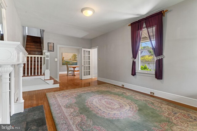 12 E Charles St, Palmyra, NJ 08065 - unfurnished living room with wood finished floors and stairs