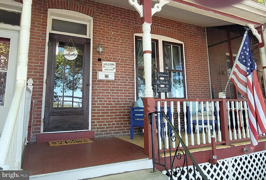 131 2nd Ave, Roebling, NJ 08554 - entrance to property with covered porch and brick siding