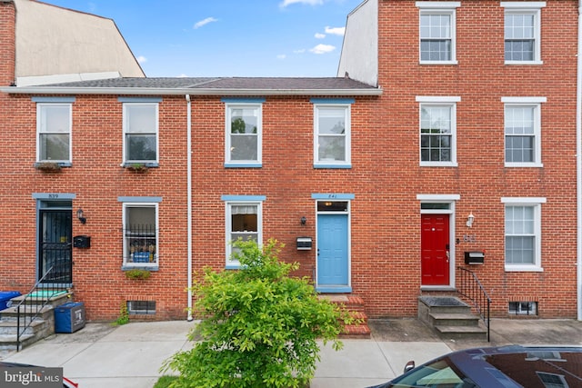 841 Mchenry St, Baltimore, MD 21230 - view of front of property with brick siding, entry steps, and roof with shingles