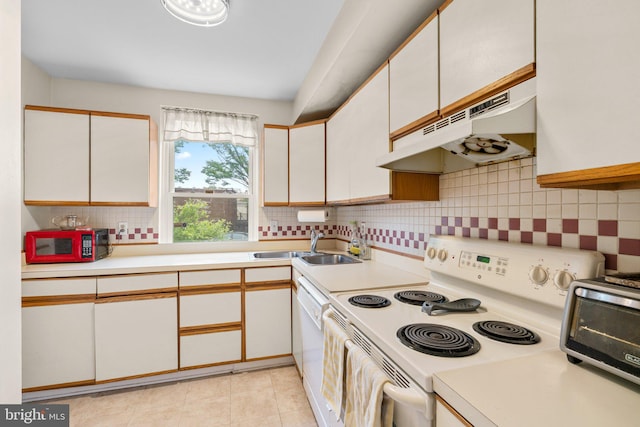 841 Mchenry St, Baltimore, MD 21230 - kitchen featuring white appliances, under cabinet range hood, light countertops, a sink, and tasteful backsplash