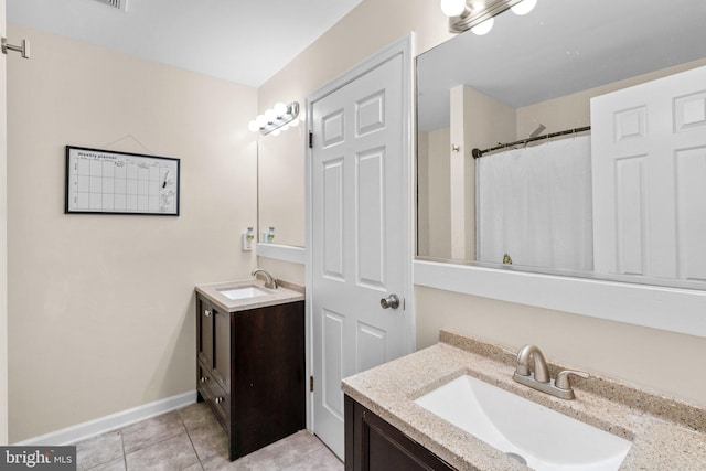 841 Mchenry St, Baltimore, MD 21230 - full bath with vanity, tile patterned flooring, and baseboards