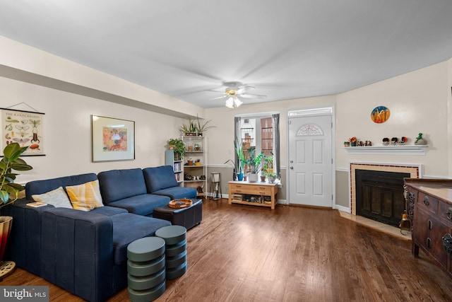 841 Mchenry St, Baltimore, MD 21230 - living area with a fireplace, wood finished floors, a ceiling fan, and baseboards