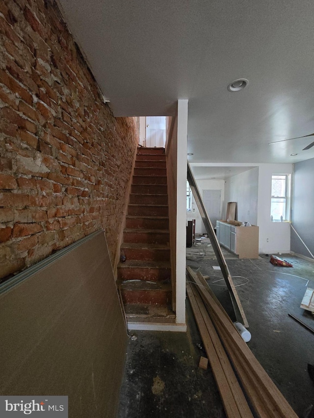 3951 N Delhi St, Philadelphia, PA 19140 - staircase featuring brick wall