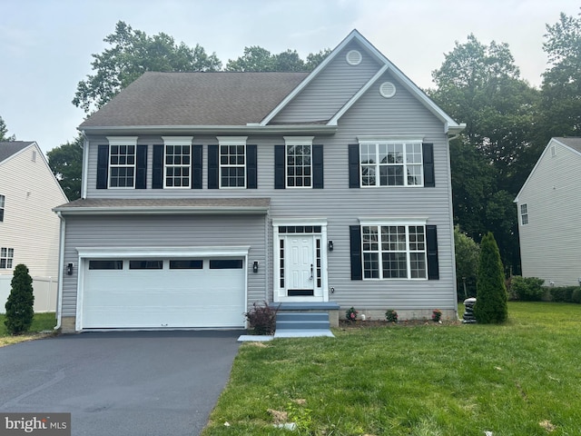 268 Albacore Dr, Frederica, DE 19946 - colonial home featuring driveway, a front lawn, and a garage