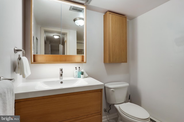 9309 E Parkhill Dr, Bethesda, MD 20814 - half bath featuring vanity, toilet, and baseboard heating