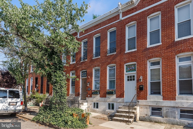 107 W Ostend St, Baltimore, MD 21230 - view of front of home with entry steps and brick siding