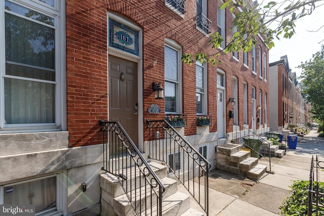 107 W Ostend St, Baltimore, MD 21230 - property entrance featuring brick siding