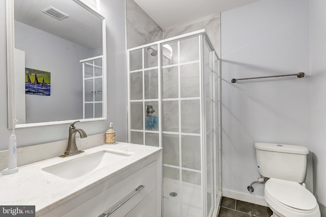 107 W Ostend St, Baltimore, MD 21230 - full bath featuring vanity, a shower stall, toilet, and tile patterned flooring