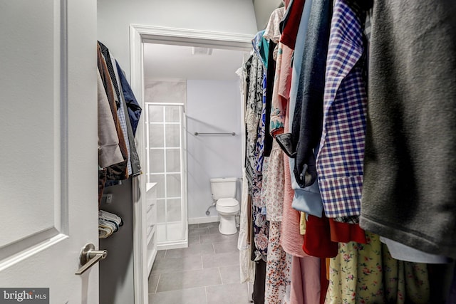 107 W Ostend St, Baltimore, MD 21230 - bathroom with a stall shower, toilet, and tile patterned flooring