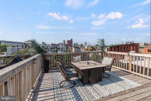 107 W Ostend St, Baltimore, MD 21230 - wooden terrace with outdoor dining area and a view of city