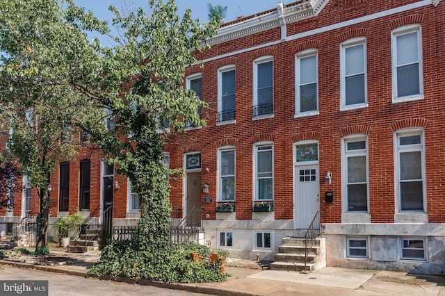 107 W Ostend St, Baltimore, MD 21230 - view of property with entry steps and brick siding