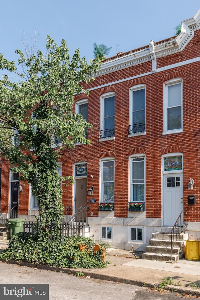 107 W Ostend St, Baltimore, MD 21230 - townhome / multi-family property with entry steps and brick siding