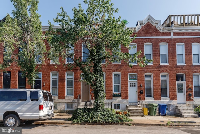 107 W Ostend St, Baltimore, MD 21230 - townhome / multi-family property with entry steps and brick siding