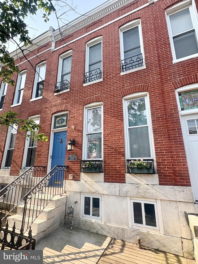 107 W Ostend St, Baltimore, MD 21230 - view of property with brick siding