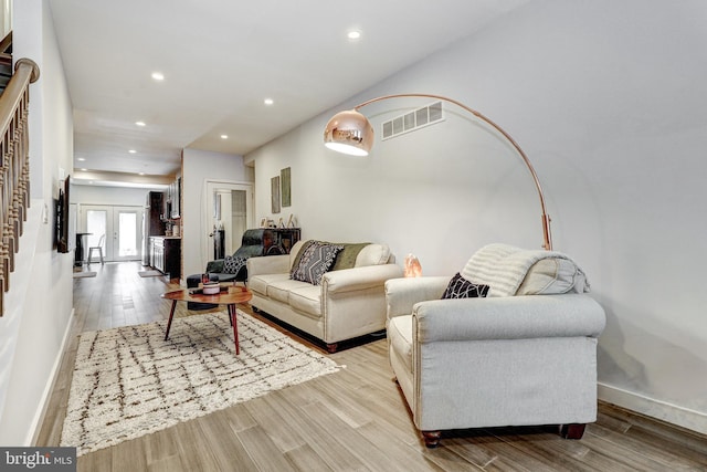 107 W Ostend St, Baltimore, MD 21230 - living room with recessed lighting, light wood-type flooring, baseboards, and french doors
