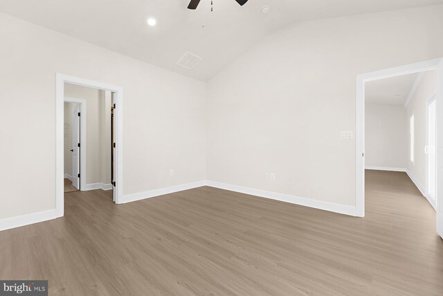5205 Mccormick Ave, Baltimore, MD 21206 - spare room with a ceiling fan, wood finished floors, vaulted ceiling, baseboards, and recessed lighting
