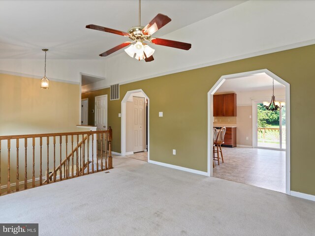 1946 Londontowne Dr, Hagerstown, MD 21740 - spare room with vaulted ceiling, light colored carpet, a chandelier, a ceiling fan, and arched walkways