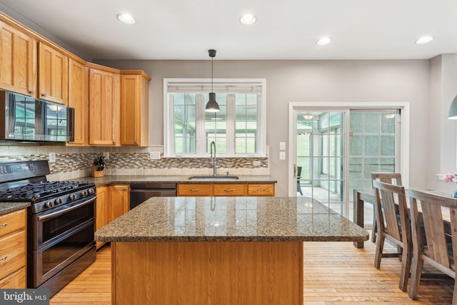 702 Iris Ln, Media, PA 19063 - kitchen featuring appliances with stainless steel finishes, a sink, backsplash, light wood-style floors, and recessed lighting