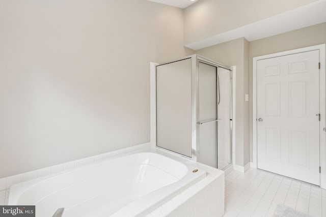 702 Iris Ln, Media, PA 19063 - full bath featuring a garden tub, a stall shower, and tile patterned flooring