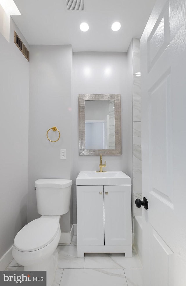 538 N Lakewood Ave, Baltimore, MD 21205 - bathroom featuring baseboards, toilet, marble finish floors, and vanity