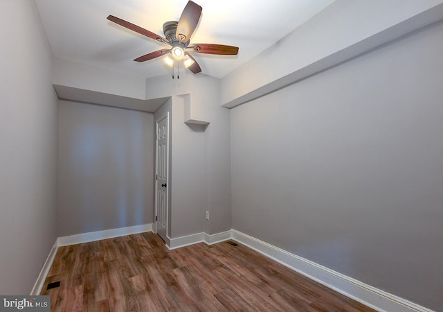 538 N Lakewood Ave, Baltimore, MD 21205 - empty room with ceiling fan, dark wood finished floors, and baseboards