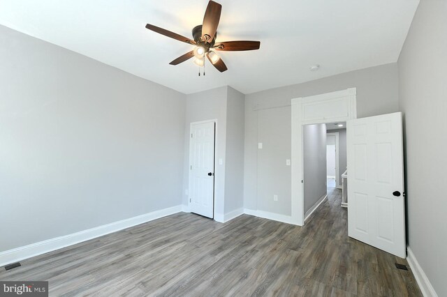 538 N Lakewood Ave, Baltimore, MD 21205 - unfurnished bedroom featuring wood finished floors, baseboards, and ceiling fan