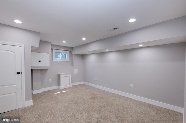 538 N Lakewood Ave, Baltimore, MD 21205 - below grade area featuring light carpet, baseboards, and recessed lighting