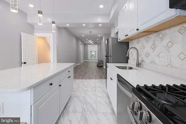 538 N Lakewood Ave, Baltimore, MD 21205 - kitchen with appliances with stainless steel finishes, recessed lighting, a sink, white cabinetry, and light marble finish floors