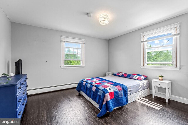 73 Swallow, Southampton, PA 18966 - bedroom with baseboard heating, dark wood finished floors, and baseboards