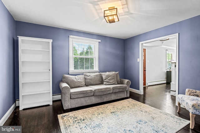 73 Swallow, Southampton, PA 18966 - living area with a baseboard heating unit, plenty of natural light, and dark wood-type flooring